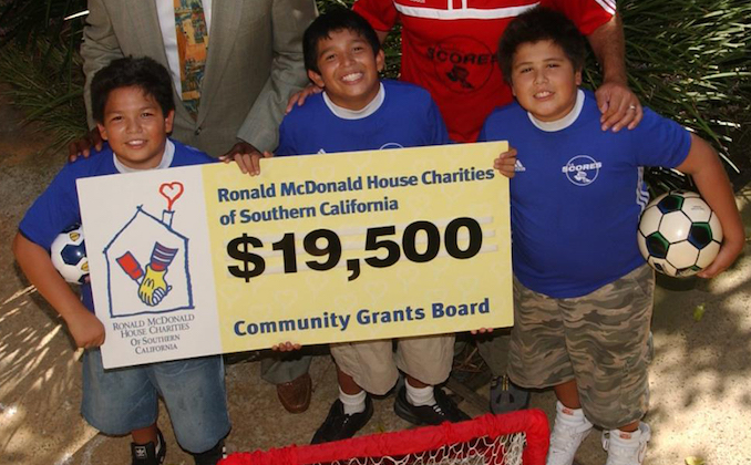 Soccer kids receiving a RMHCSC Grant Check
